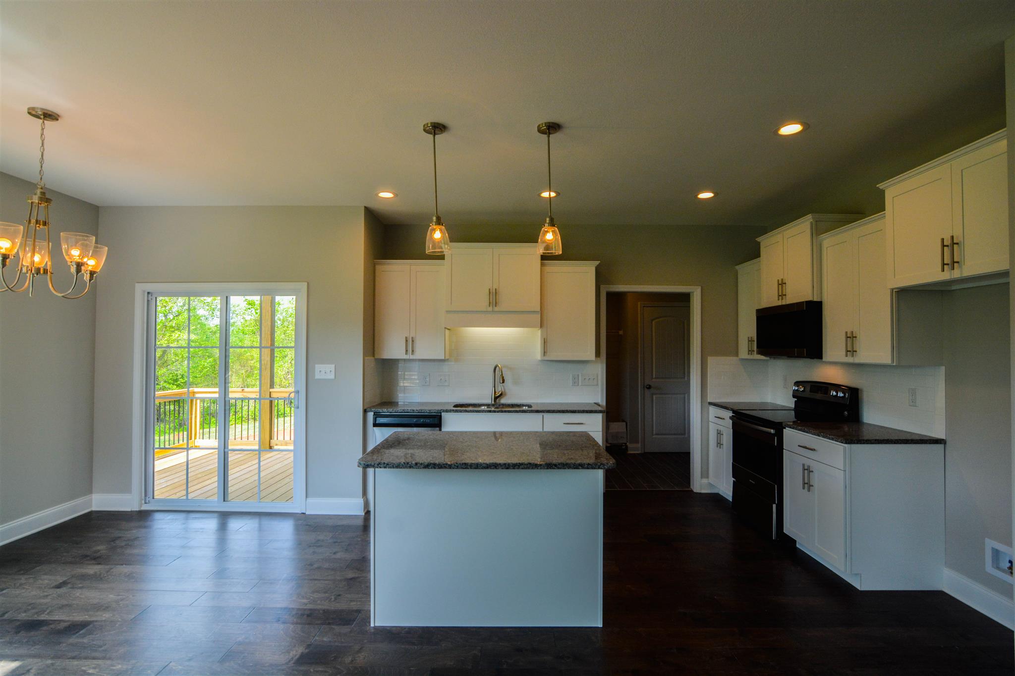780 Grays Chapel Road Southside, TN 37171 - Photo 8 of 30 a kitchen with kitchen island a counter top space a sink stainless steel appliances and cabinets