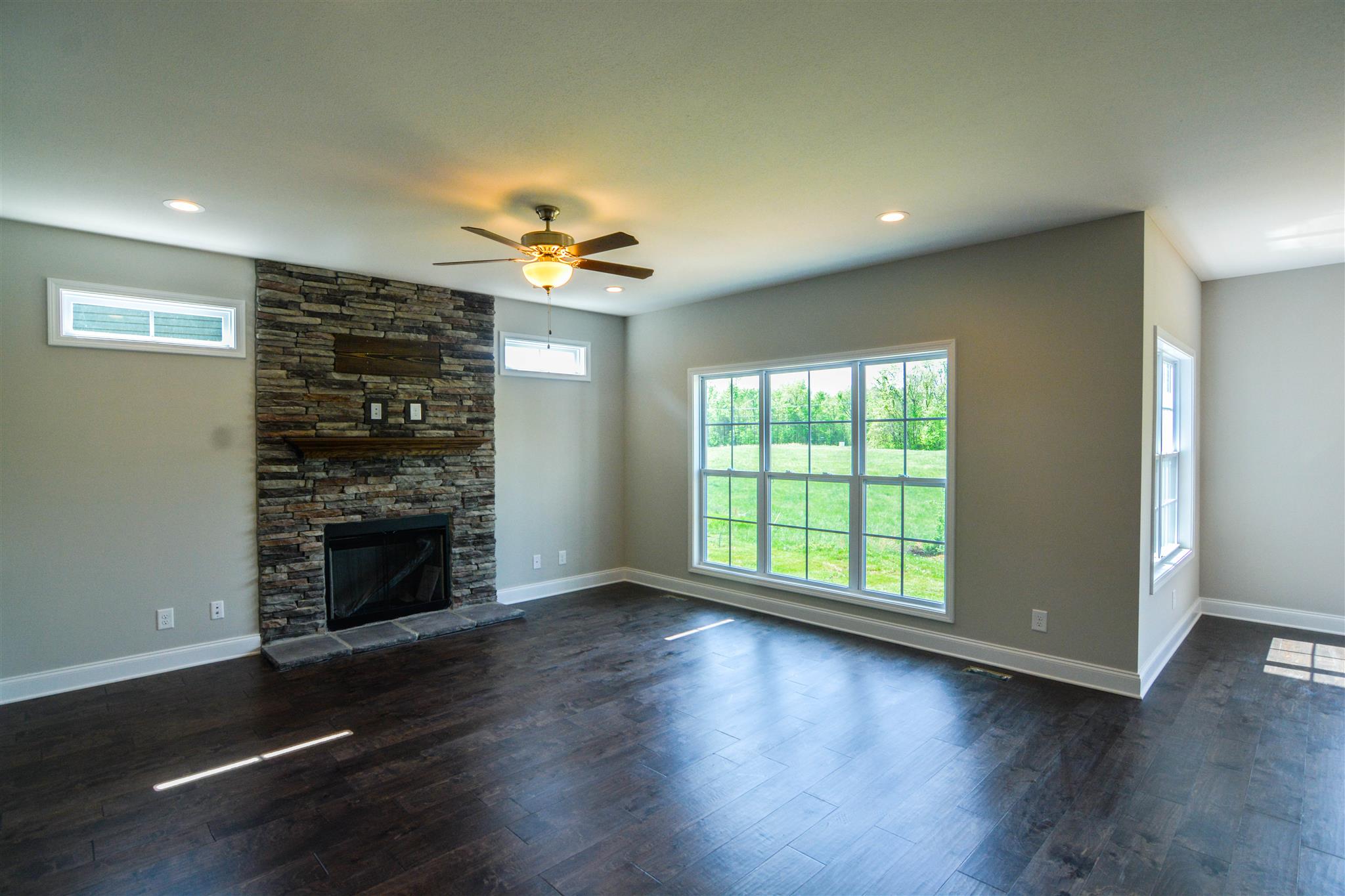780 Grays Chapel Road Southside, TN 37171 - Photo 10 of 30 a view of an empty room with a fireplace and a window