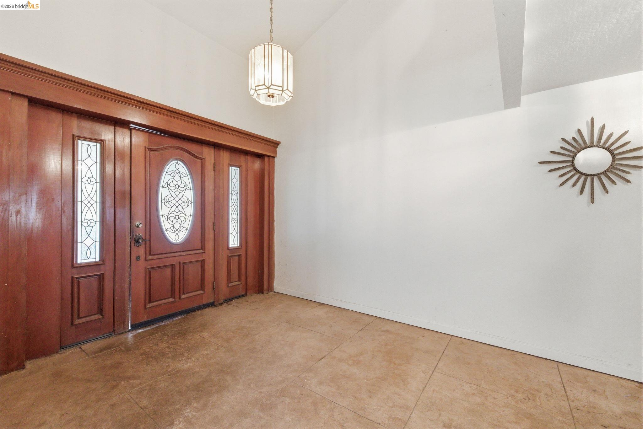 23608 Porcina Way Columbia, CA 95310 - Photo 29 of 51 Entryway with suspended lighting and vaulted ceiling