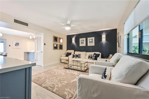 a view of living room with furniture and flat screen tv
