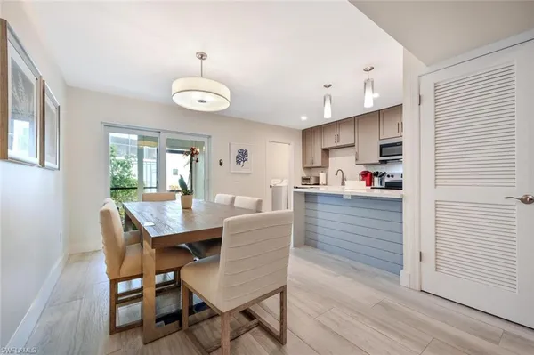 a view of a dining room with furniture and wooden floor