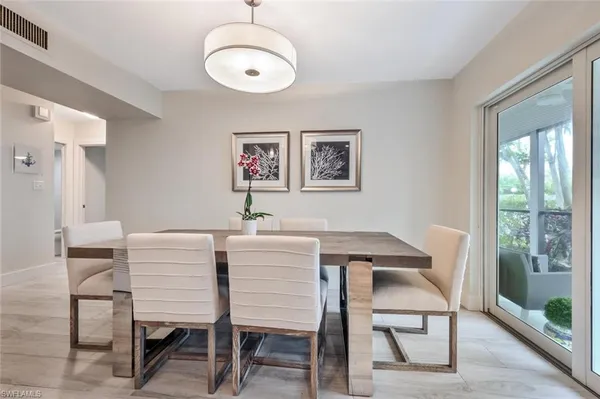a kitchen with sink refrigerator and cabinets