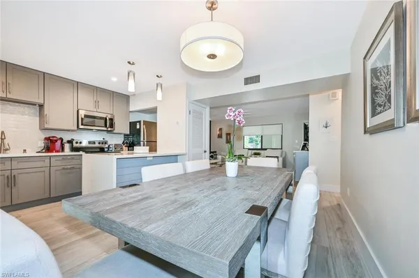 a kitchen with stainless steel appliances cabinets a microwave and sink