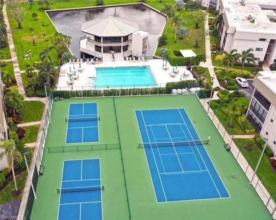 an aerial view of a house with a swimming pool