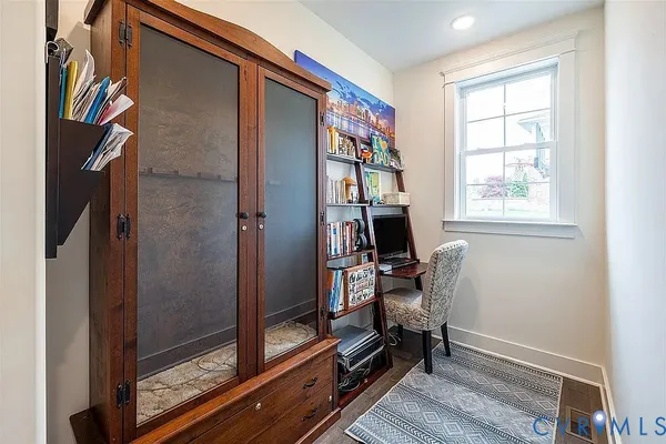 a living room with furniture fireplace and flat screen tv