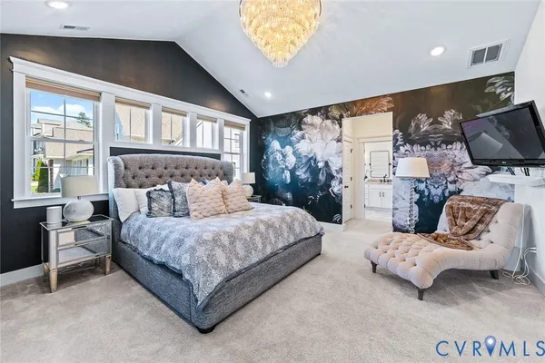 a bed sitting in a room next to a window
