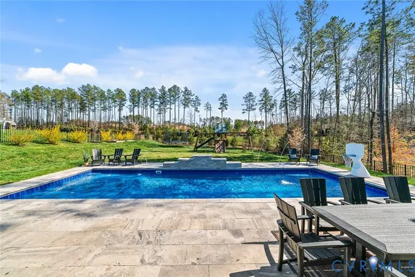 a view of a terrace with a table and chairs