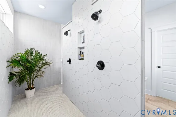 a bathroom with a bathtub and a shower curtain