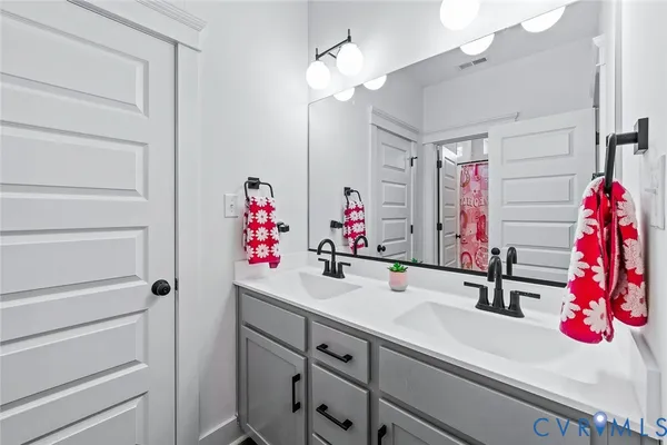 a bathroom with a bathtub and shower