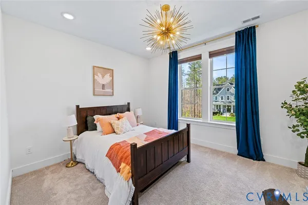 a wooden bench sitting in front of a building