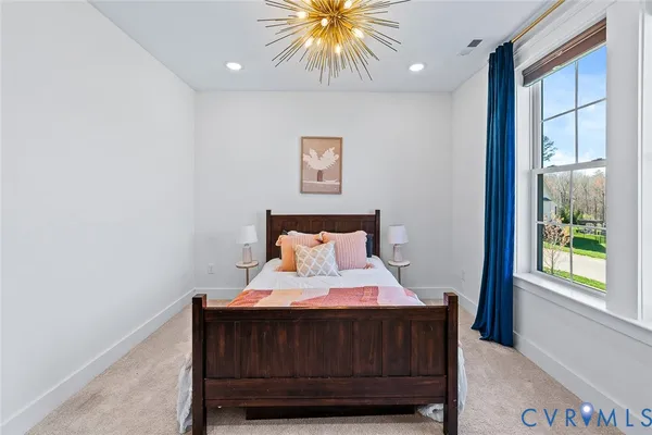 a view of a house with swimming pool and sitting area