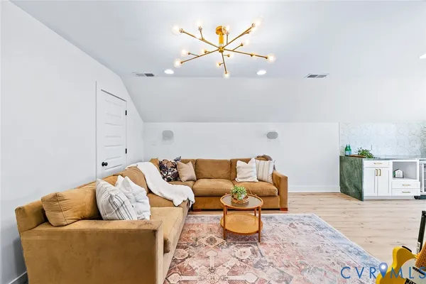 an aerial view of residential house with outdoor space and trees all around