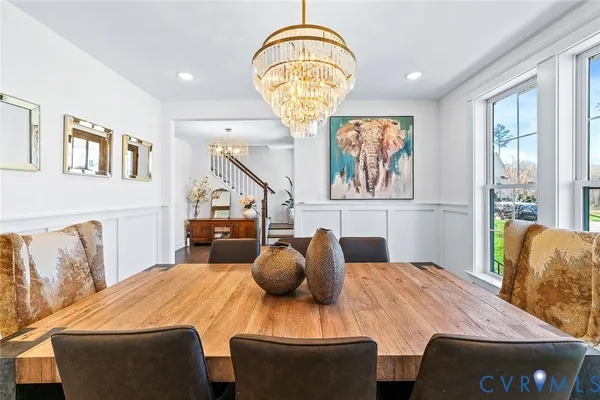 a large kitchen with kitchen island granite countertop a large counter top space and stainless steel appliances