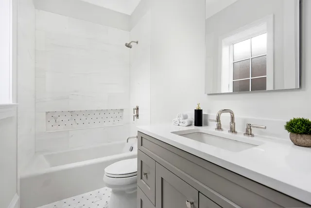 a bathroom with a sink a toilet and a bathtub