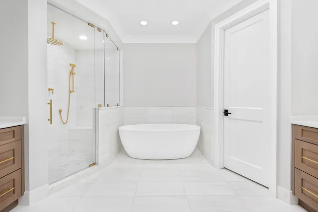 a bathroom with a bathtub and a shower