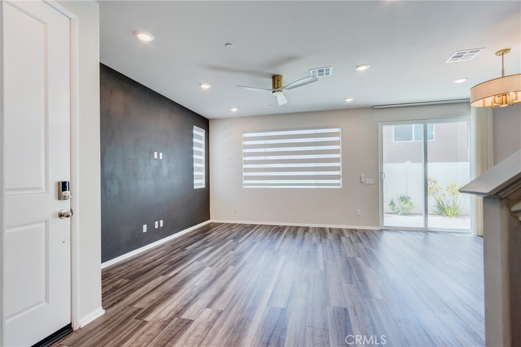 36469 Shine Drive Winchester, CA 92596 - Photo 11 of 73 wooden floor in an empty room with a window