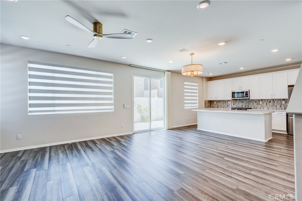 36469 Shine Drive Winchester, CA 92596 - Photo 14 of 73 a view of kitchen with cabinets and wooden floor