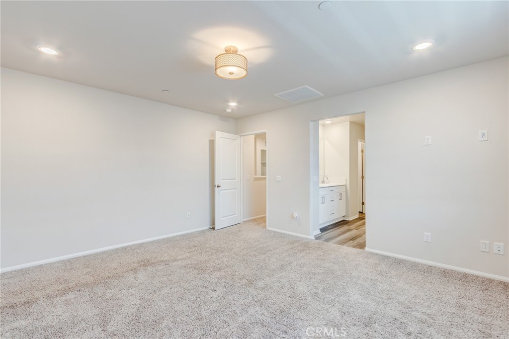 36469 Shine Drive Winchester, CA 92596 - Photo 20 of 73 an empty room with a ceiling fan and window