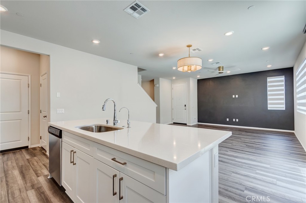 36469 Shine Drive Winchester, CA 92596 - Photo 10 of 73 a kitchen with a sink cabinets and wooden floor