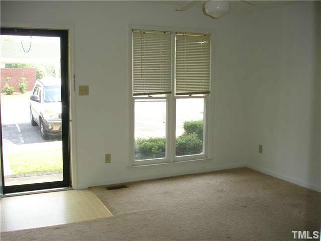200-210 North Hollybrook Road Wendell, NC 27591 - Photo 2 of 4 an empty room with a window