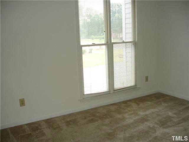 200-210 North Hollybrook Road Wendell, NC 27591 - Photo 4 of 4 a view of an empty room and window