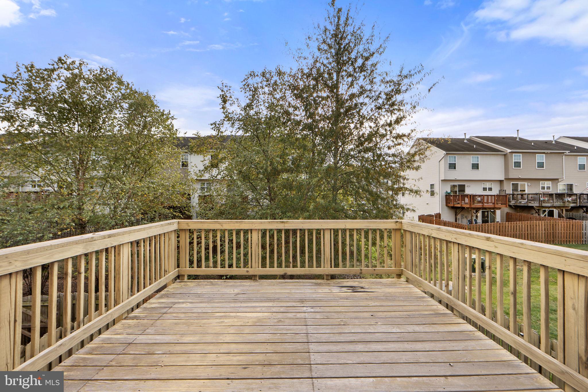 2210 Mallard Landing Drive Fredericksburg, VA 22408 - Photo 17 of 30 a view of a deck with wooden floor and fence