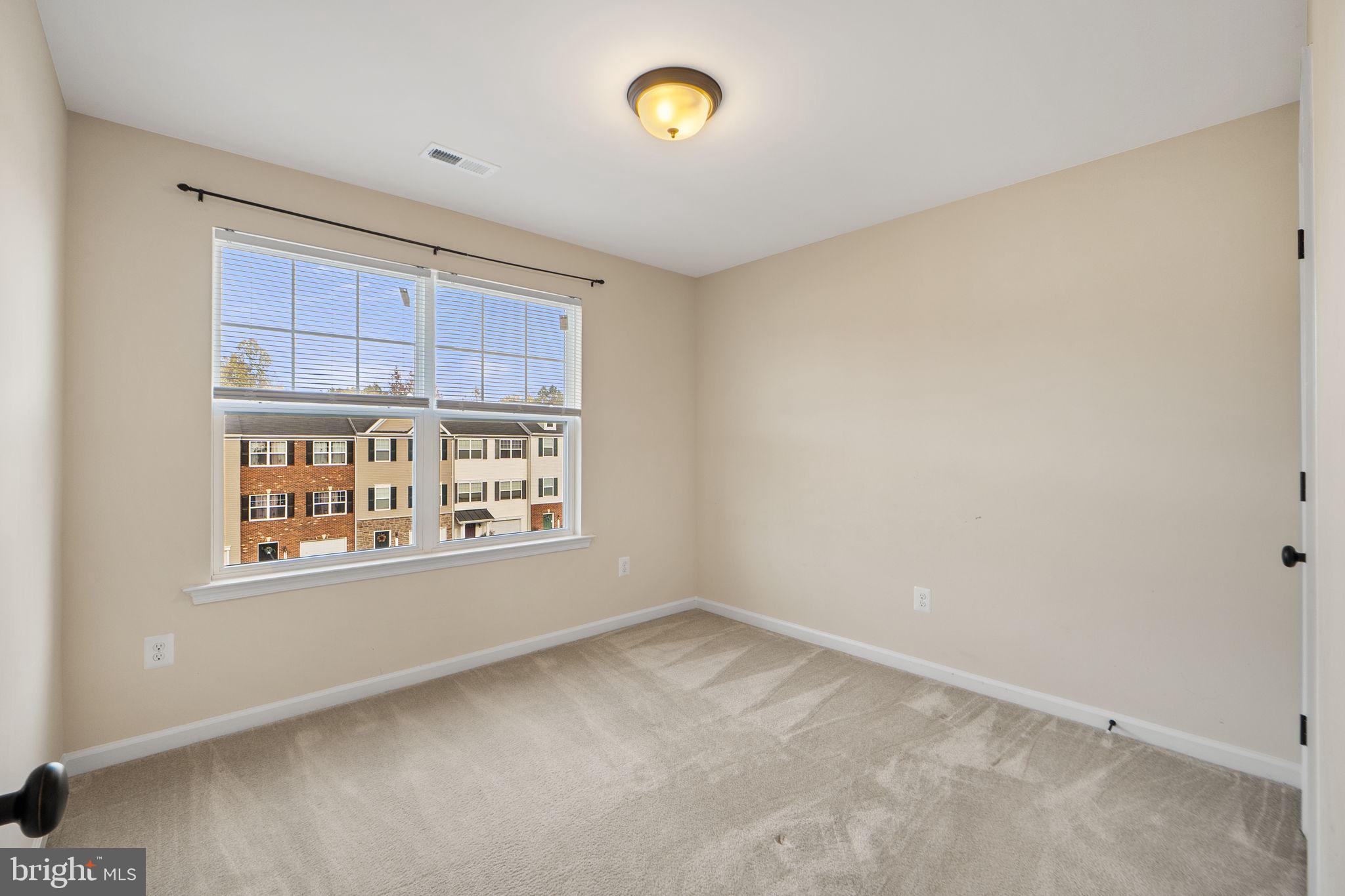 2210 Mallard Landing Drive Fredericksburg, VA 22408 - Photo 22 of 30 a view of an empty room with a window