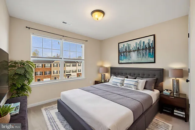 a bedroom with bed and a window