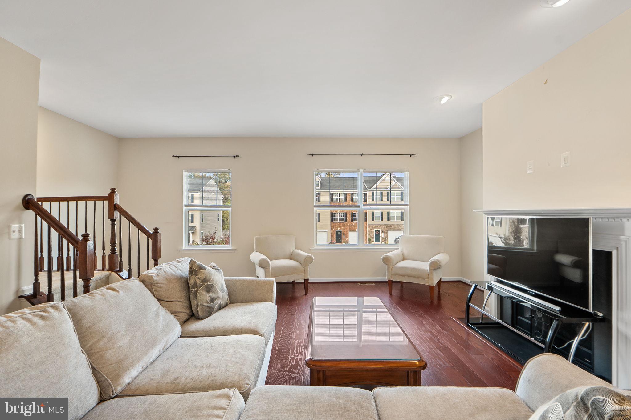2210 Mallard Landing Drive Fredericksburg, VA 22408 - Photo 8 of 30 a living room with furniture wooden floor and a flat screen tv