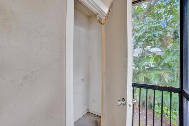 a view of a balcony with a tree