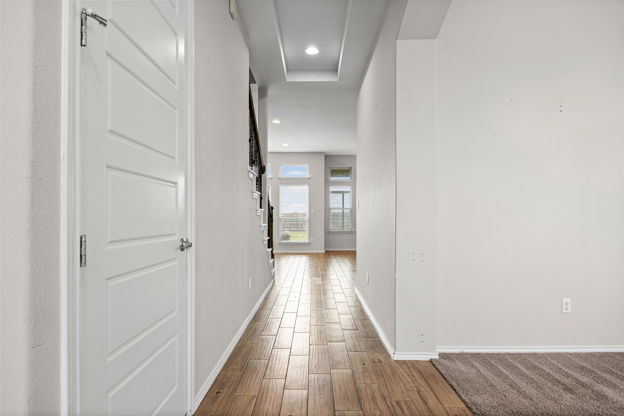 17401 Silent Harbor Loop Pflugerville, TX 78660 - Photo 4 of 37 Hallway with recessed lighting and wood finish floors