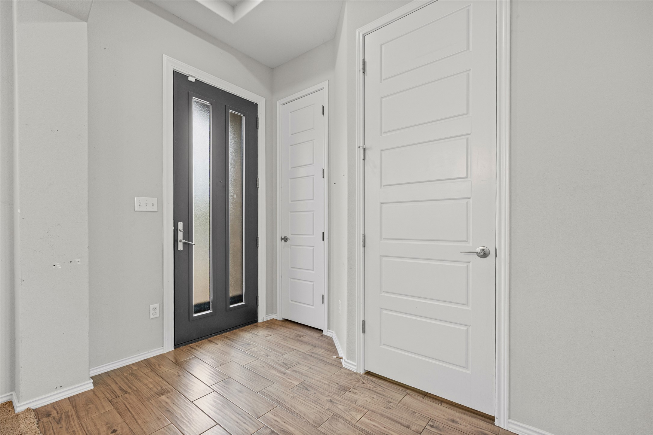 17401 Silent Harbor Loop Pflugerville, TX 78660 - Photo 5 of 37 Foyer entrance featuring light wood-type flooring and baseboards