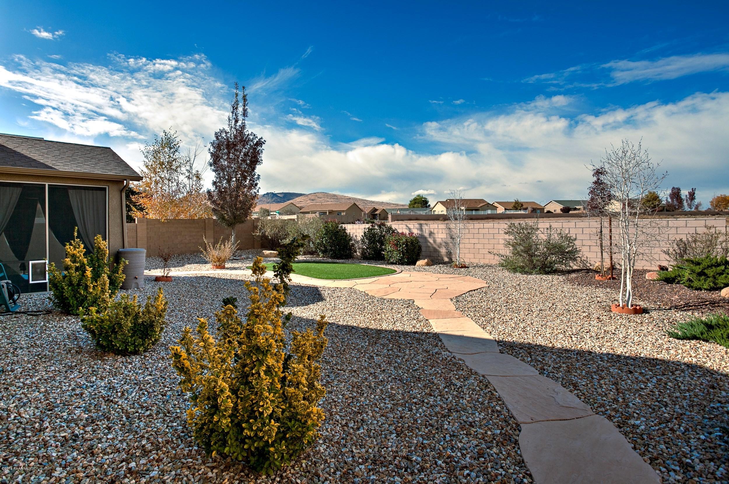 4728 Edgemont Road Prescott Valley, AZ 86314 - Photo 17 of 17 a view of a terrace with a garden