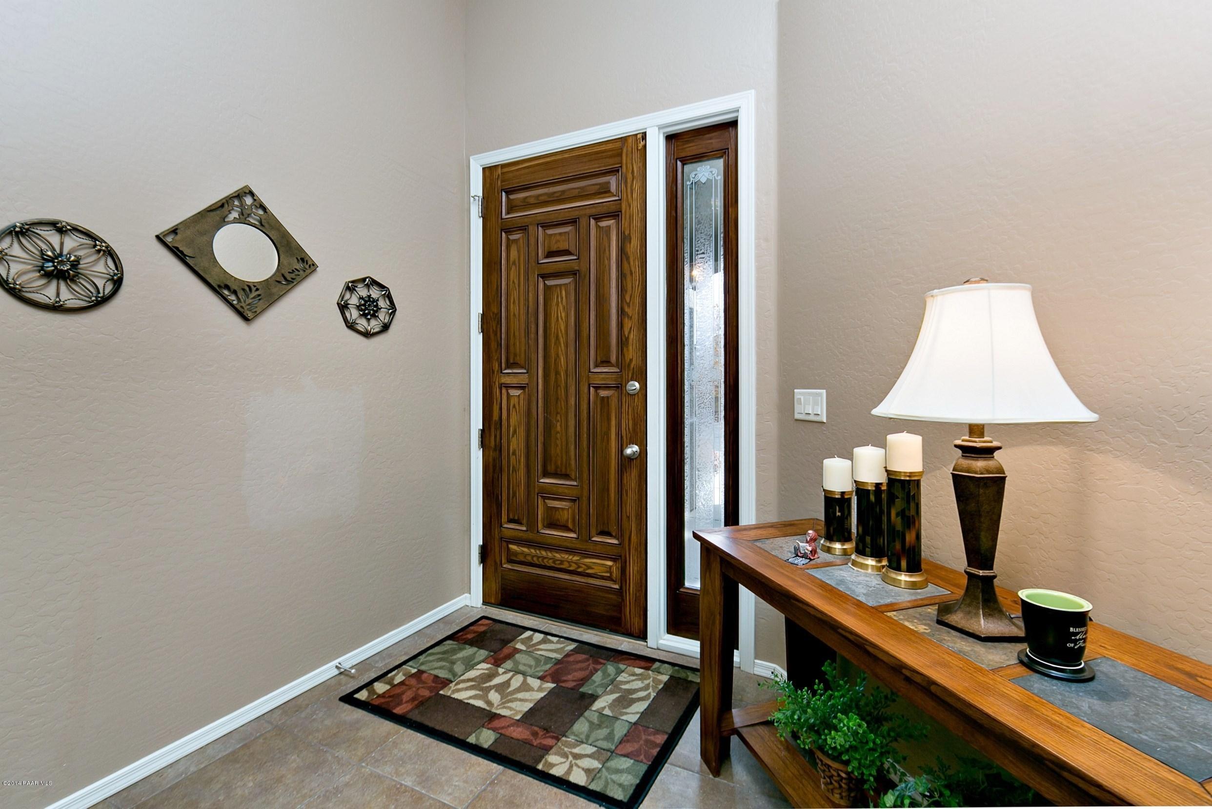 4728 Edgemont Road Prescott Valley, AZ 86314 - Photo 4 of 17 a living room with a couch and a table