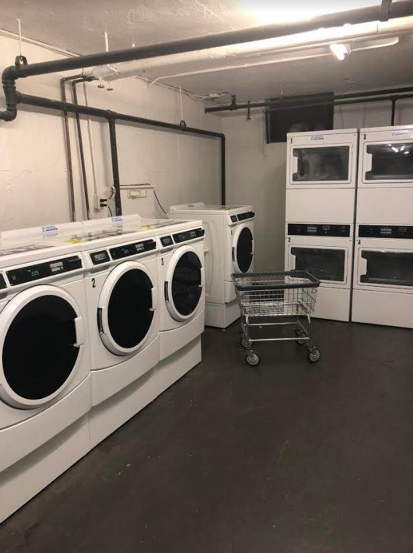 165 Vroom Street, Unit 1F Jersey City, NJ 07306 - Photo 4 of 11 a utility room with dryer and washer