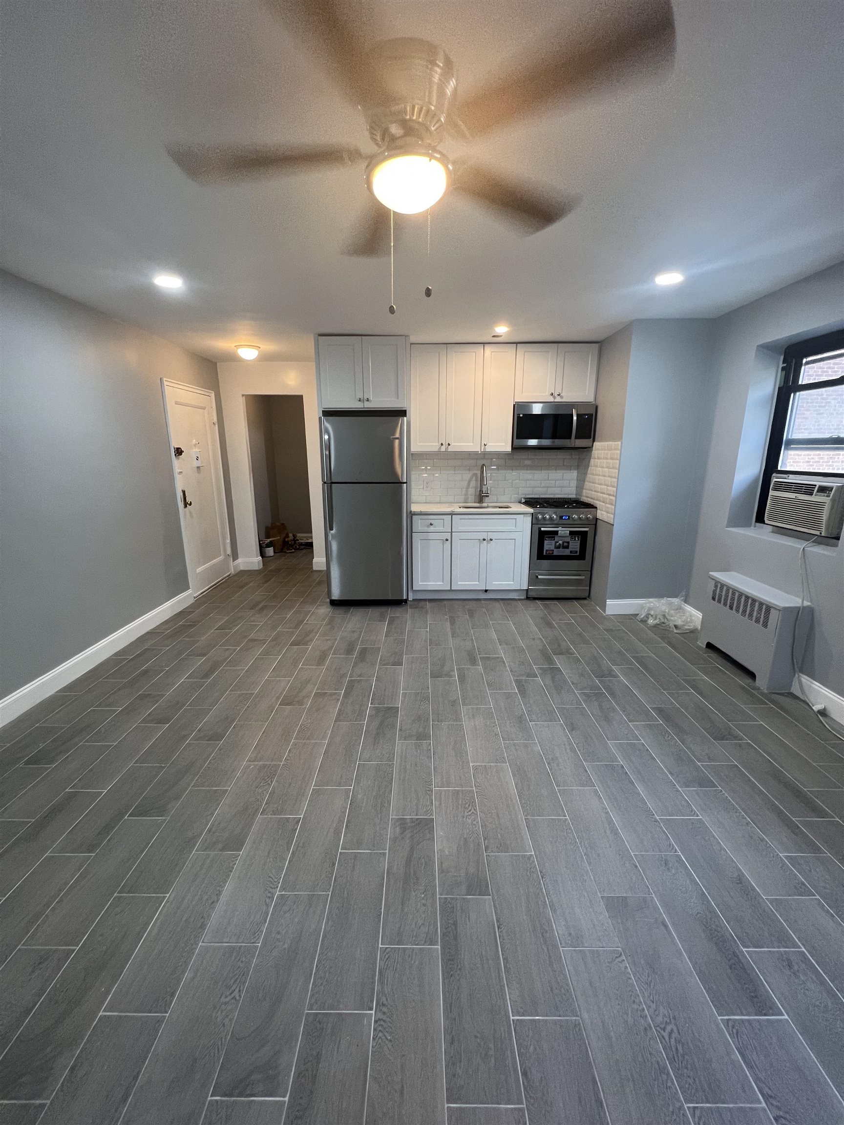 165 Vroom Street, Unit 1F Jersey City, NJ 07306 - Photo 9 of 11 a view of kitchen with microwave and stove