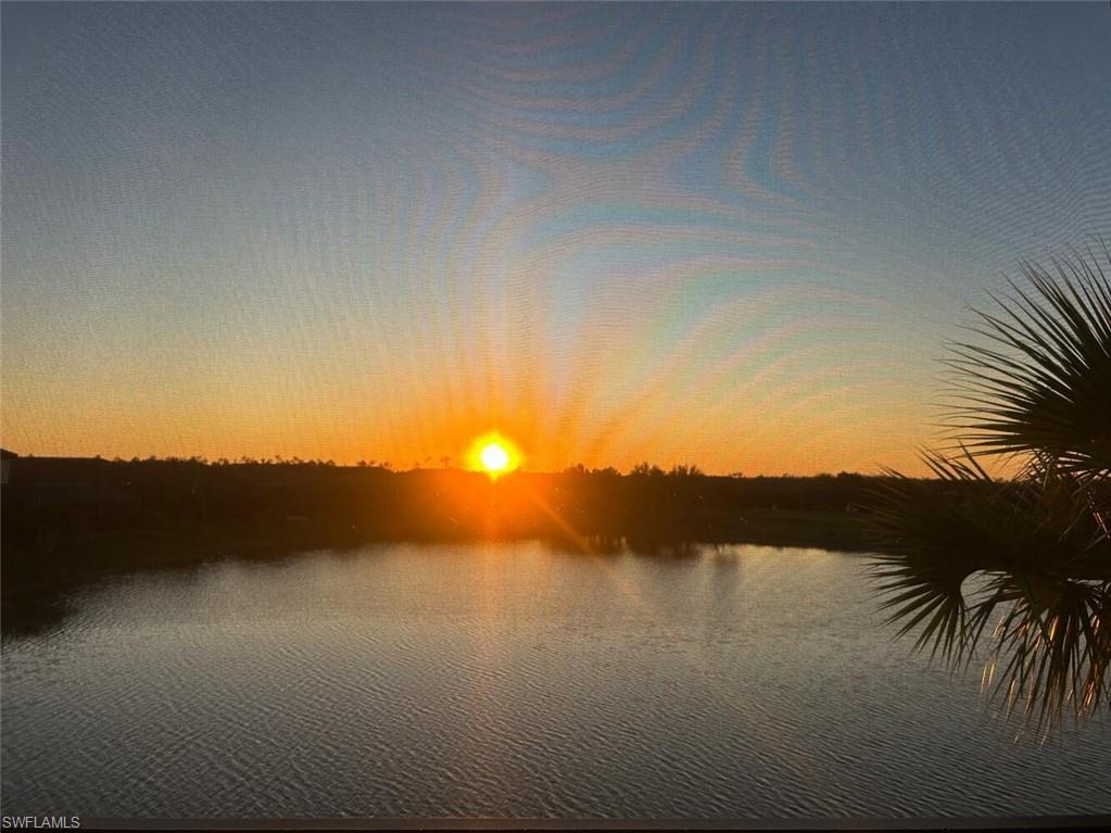 9365 Pocida Court, Unit 202 Naples, FL 34119 - Photo 2 of 40 a view of sunset and lake