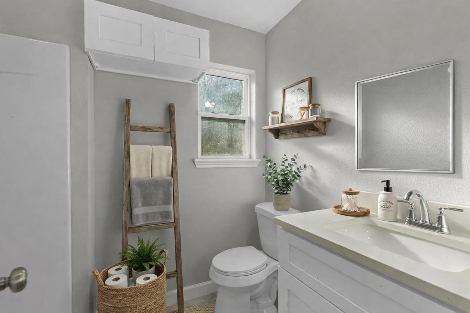 609 Debbie Lane Alvin, TX 77511 - Photo 12 of 32 a bathroom with a granite countertop toilet sink and mirror