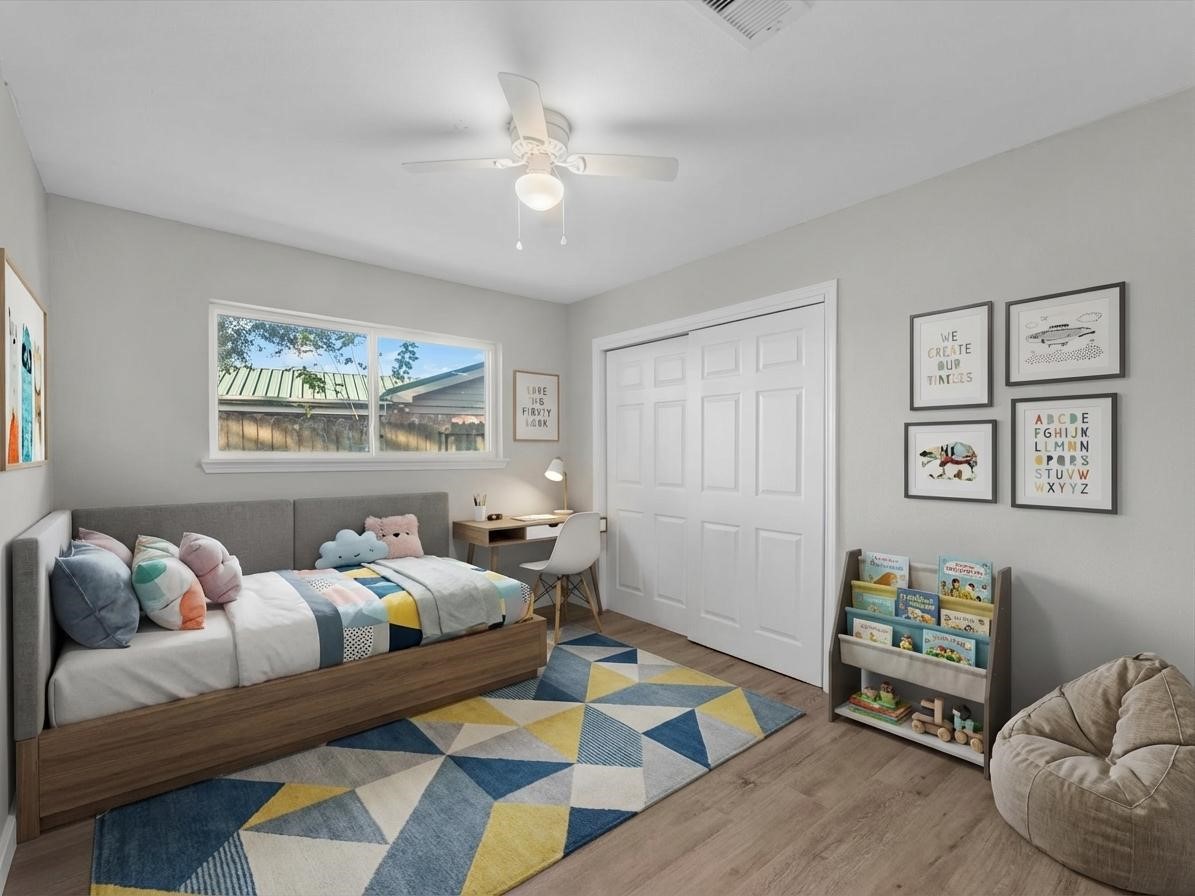 609 Debbie Lane Alvin, TX 77511 - Photo 16 of 32 a bedroom with furniture and a bed