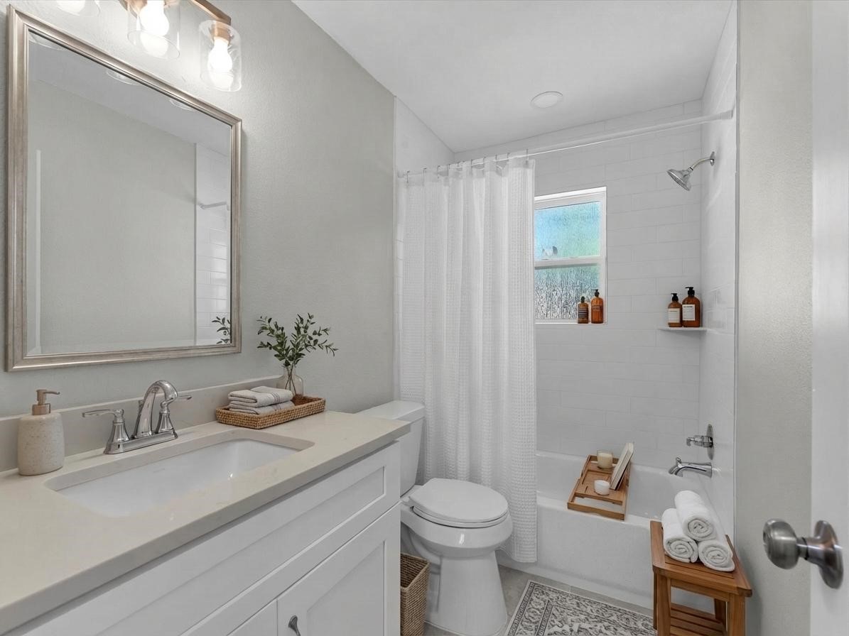 609 Debbie Lane Alvin, TX 77511 - Photo 18 of 32 a bathroom with a sink toilet and vanity