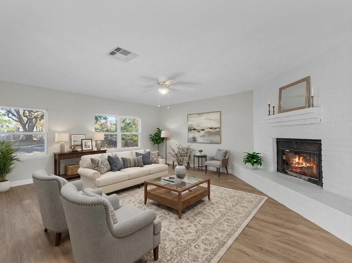 609 Debbie Lane Alvin, TX 77511 - Photo 2 of 32 a living room with furniture and a fireplace