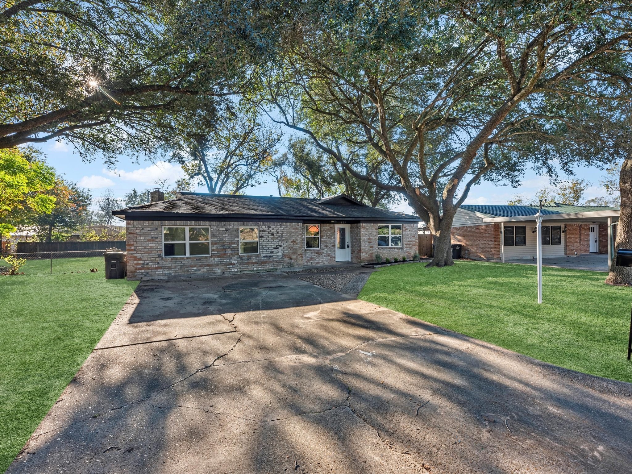 609 Debbie Lane Alvin, TX 77511 - Photo 2 of 23 a front view of a house with a yard