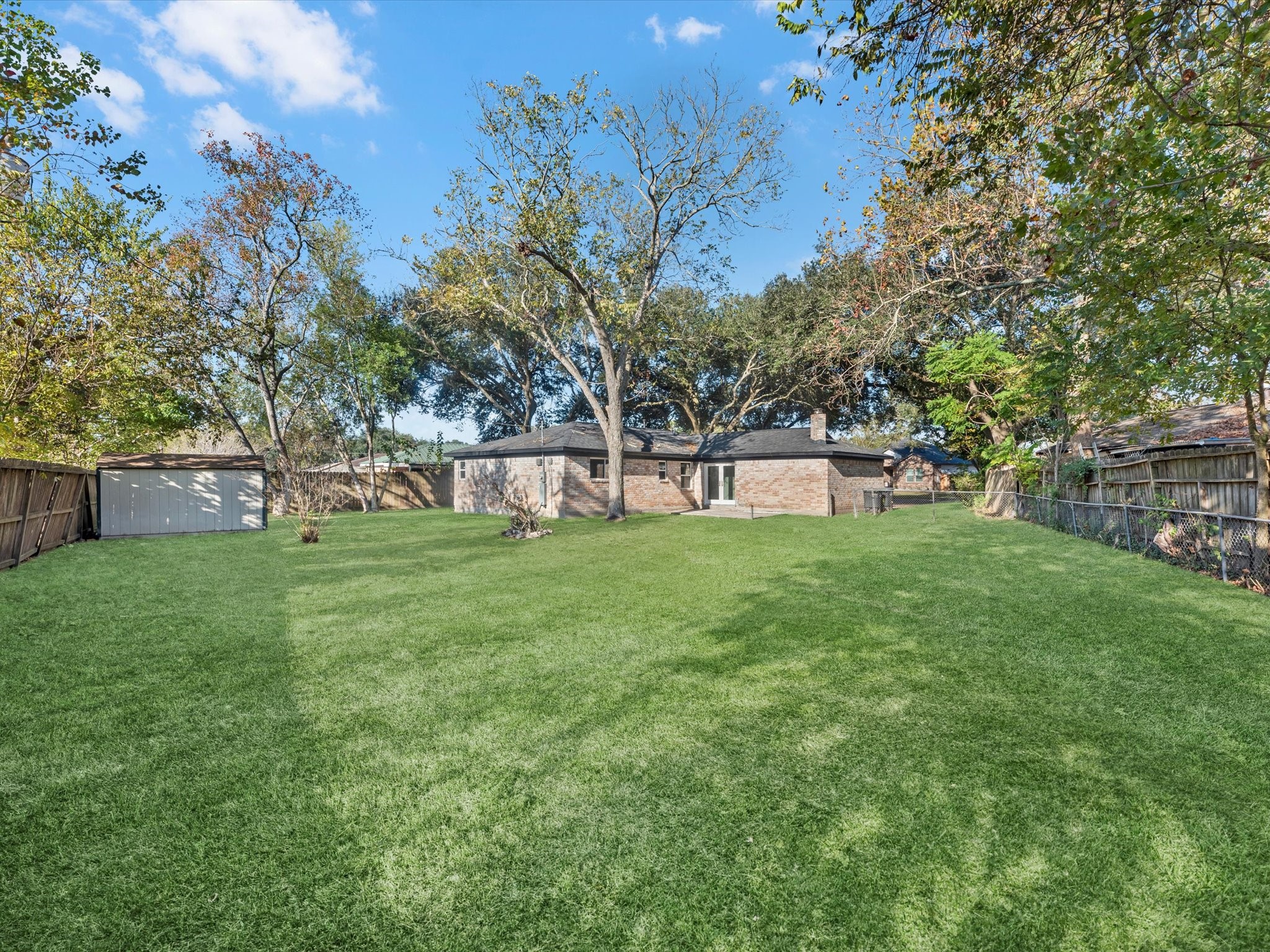 609 Debbie Lane Alvin, TX 77511 - Photo 27 of 32 a view of a house with a big yard