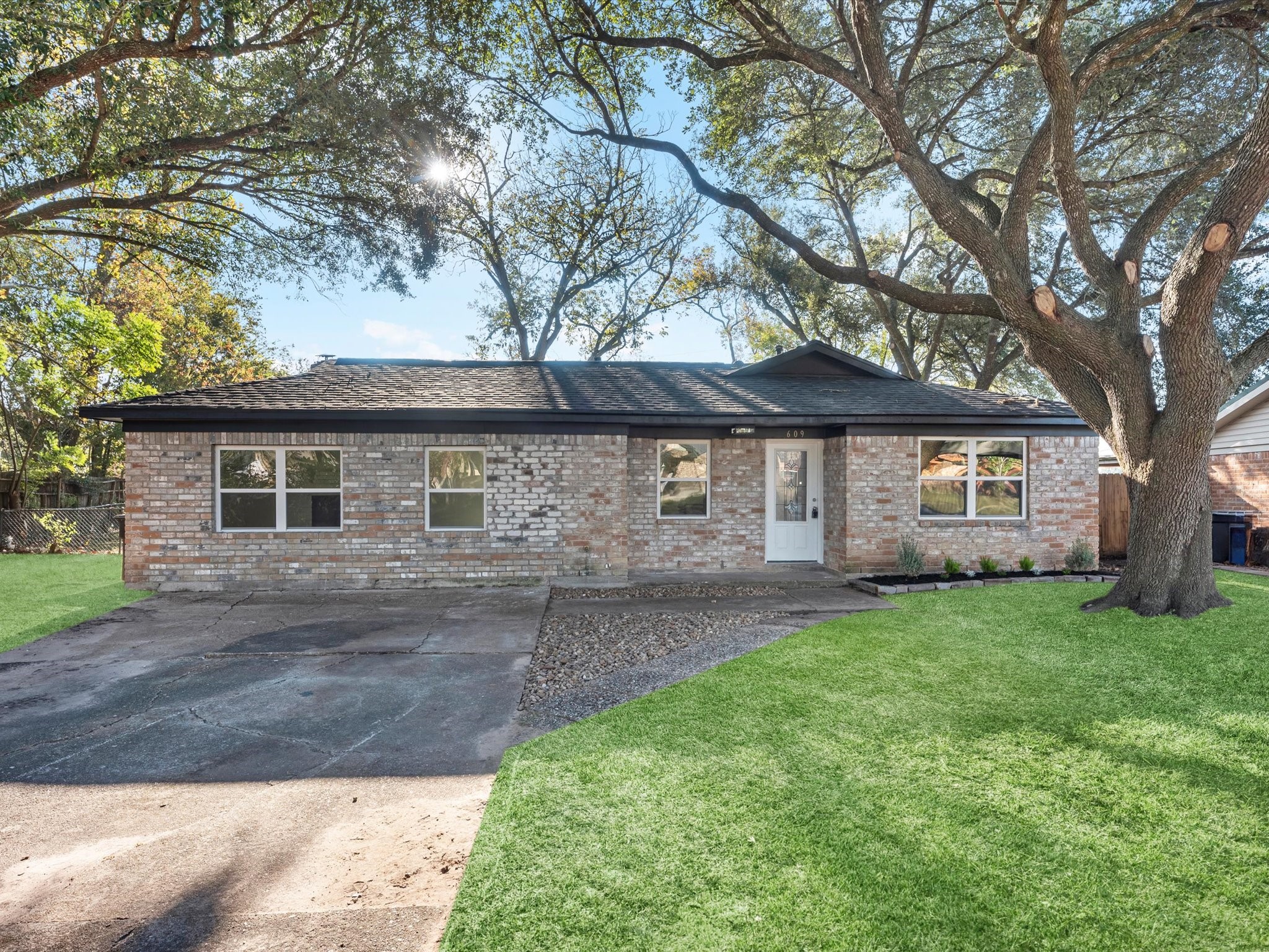 609 Debbie Lane Alvin, TX 77511 - Photo 29 of 32 a front view of a house with a garden