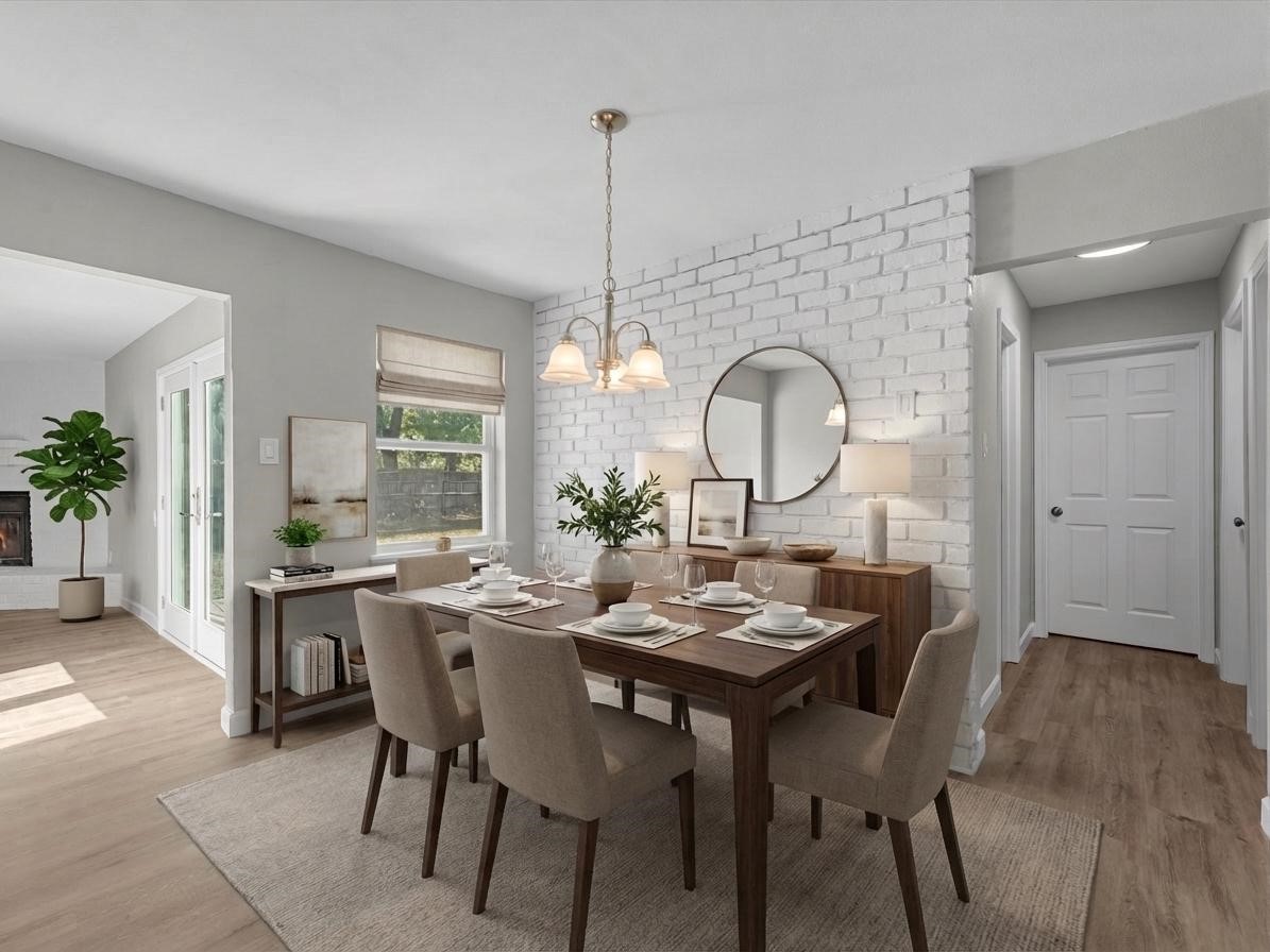 609 Debbie Lane Alvin, TX 77511 - Photo 4 of 32 a view of a dining room with furniture window and wooden floor
