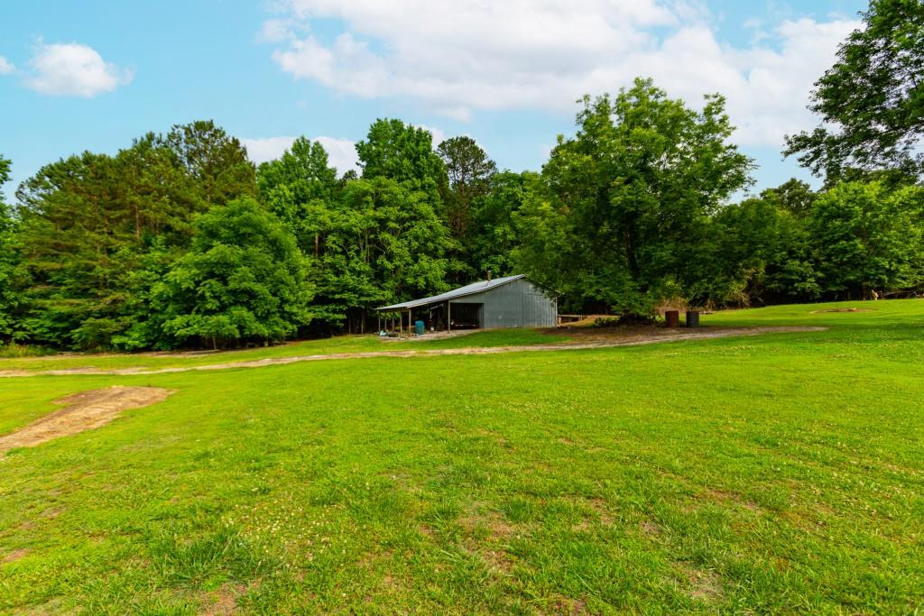 1042 Harbins Road Dacula, GA 30019 - Photo 25 of 35 a view of a green field
