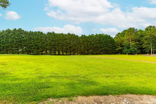 a view of a swimming pool and an outdoor seating