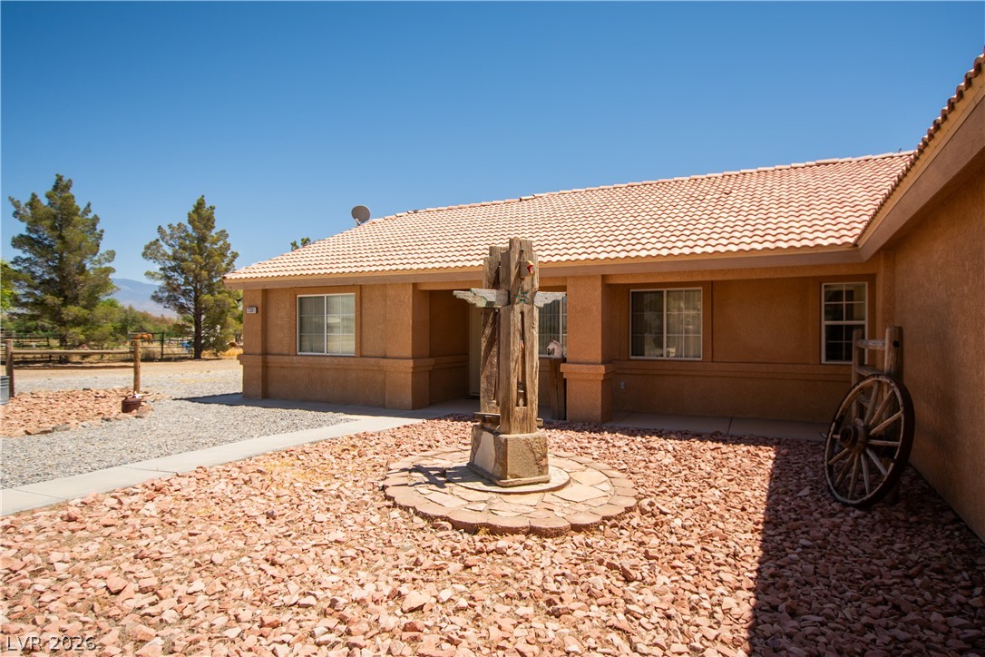 2381 Tough Boy Road Pahrump, NV 89060 - Photo 3 of 44 This charming residence features an inviting exterior with traditional architectural elements.