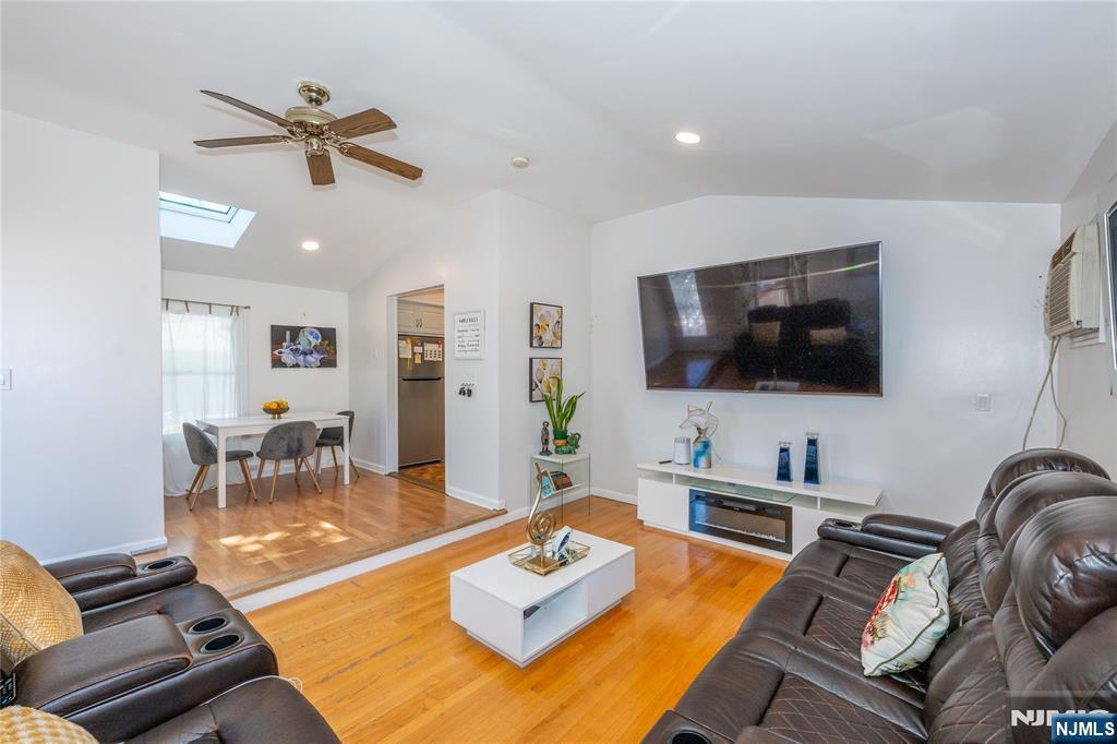 690 Garden Street Maywood, NJ 07607 - Photo 19 of 49 a living room with furniture and a flat screen tv