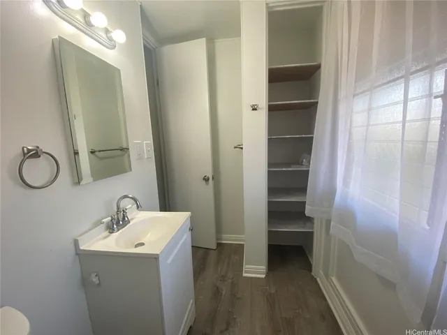 a bathroom with a sink and mirror